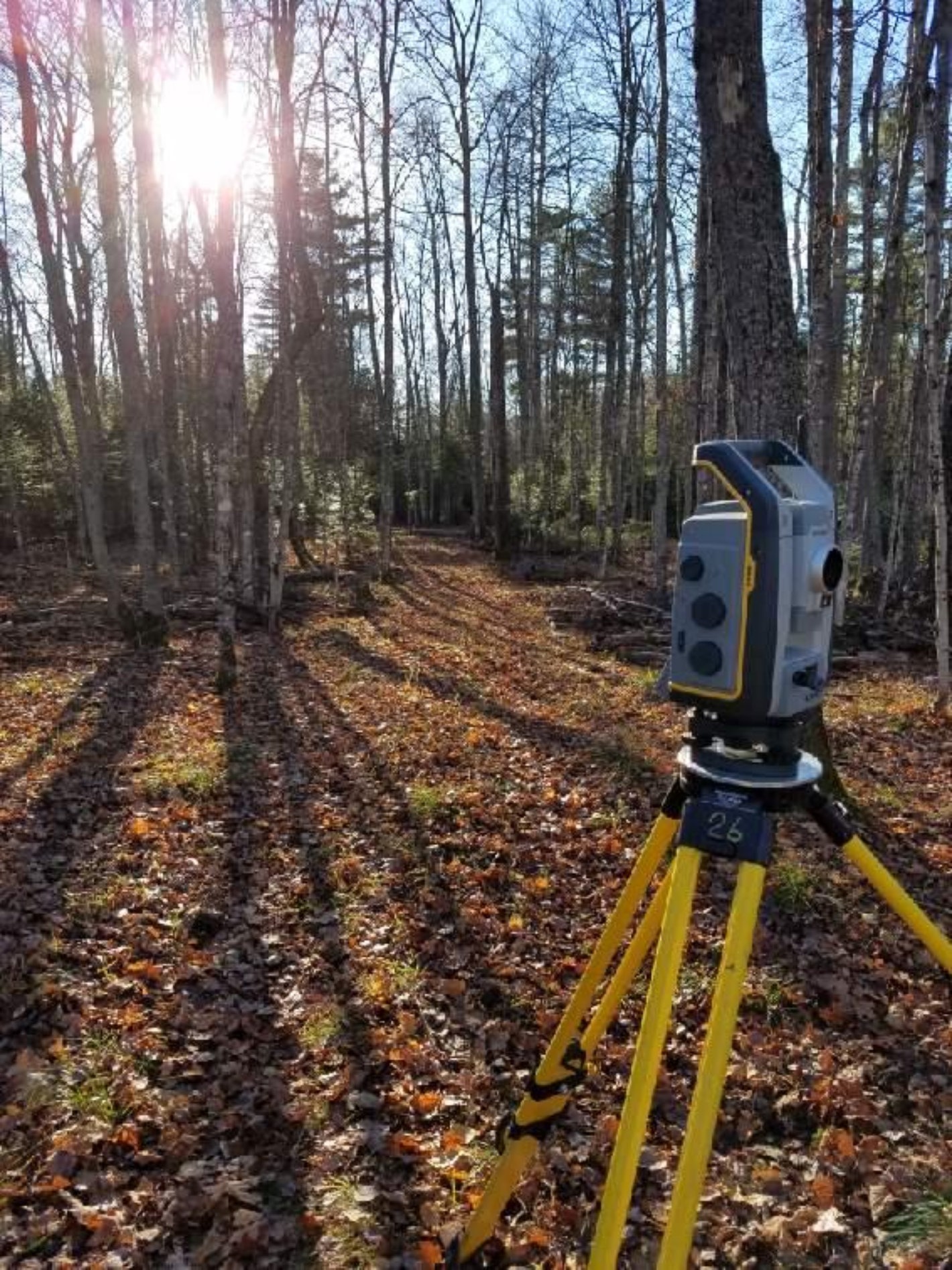 Total station surveying equipment in fall Total station surveying equipment in fall